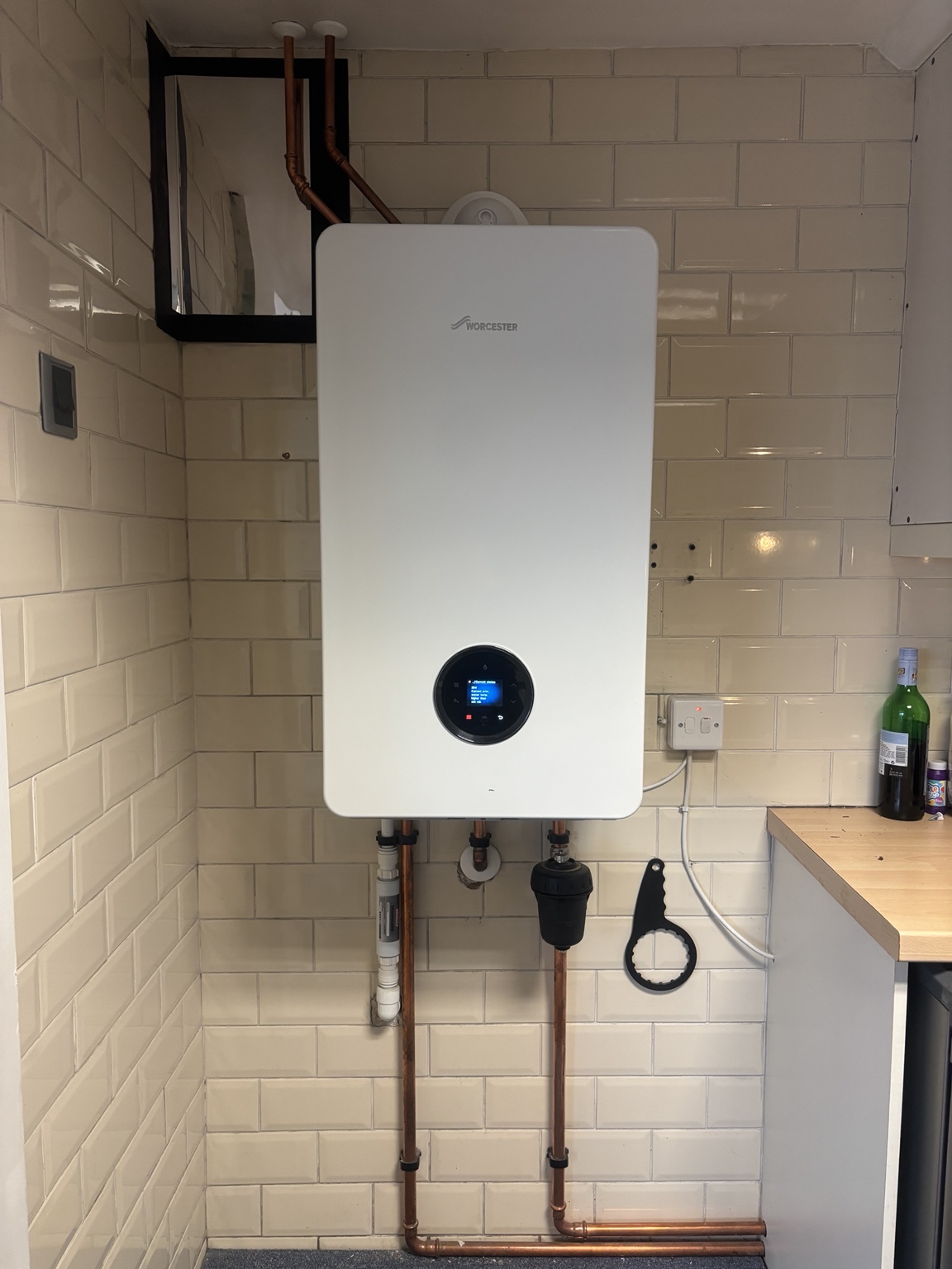Modern combi boiler installation with tidy finish