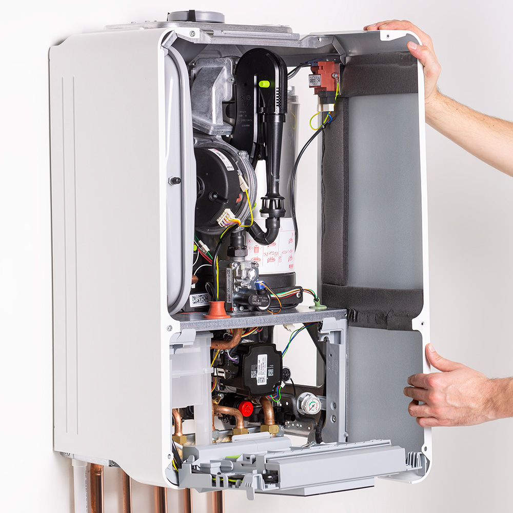 Inside view of a modern combi boiler showing the main components