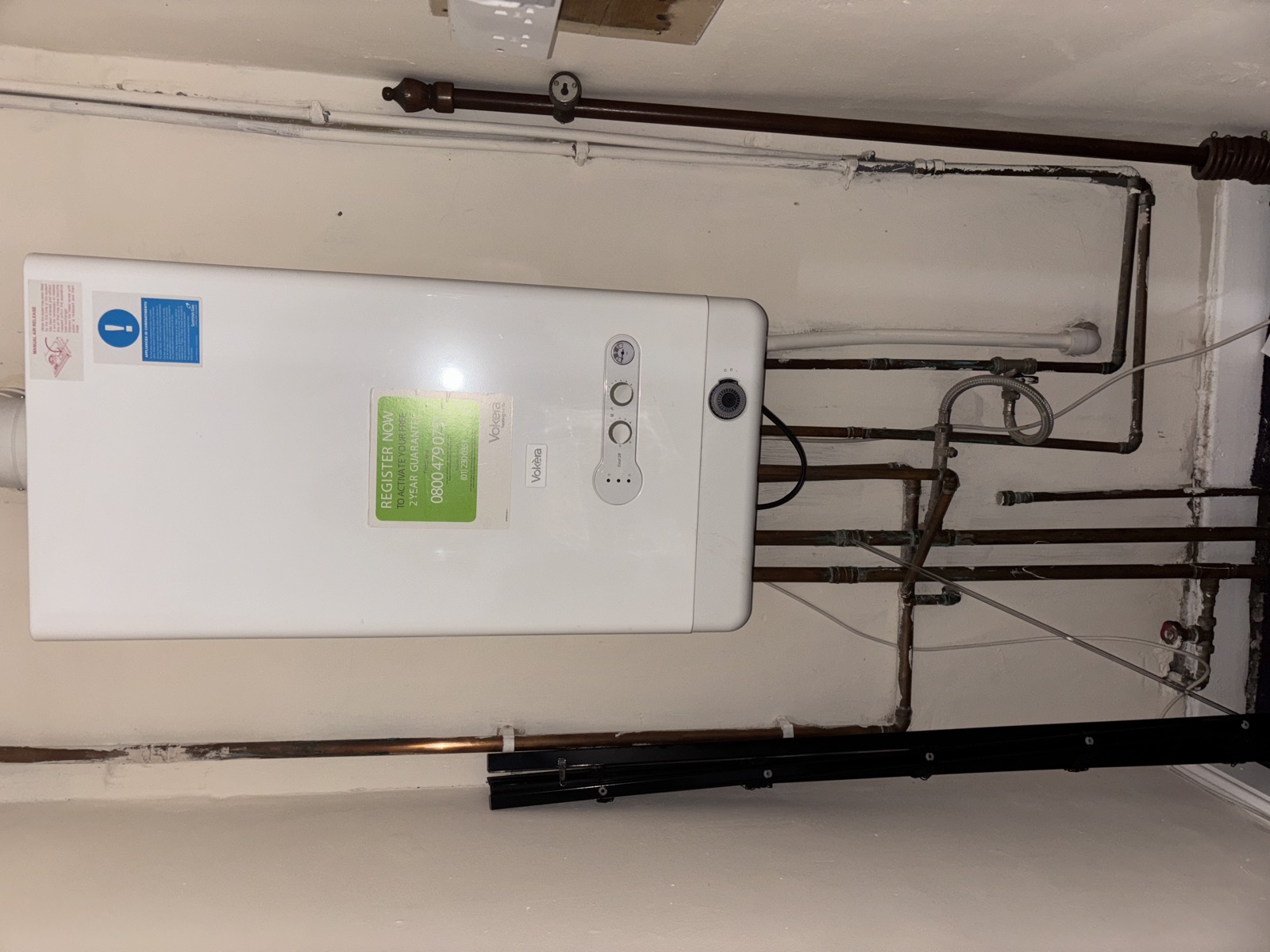 Before: older combi boiler on a recent Airdrie replacement