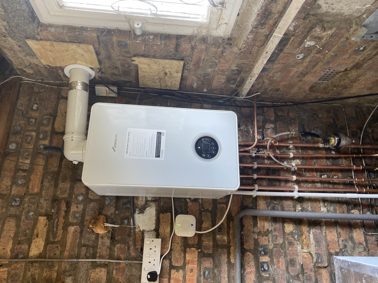 After: new combi boiler fitted on a recent Coatbridge replacement before a garage conversion